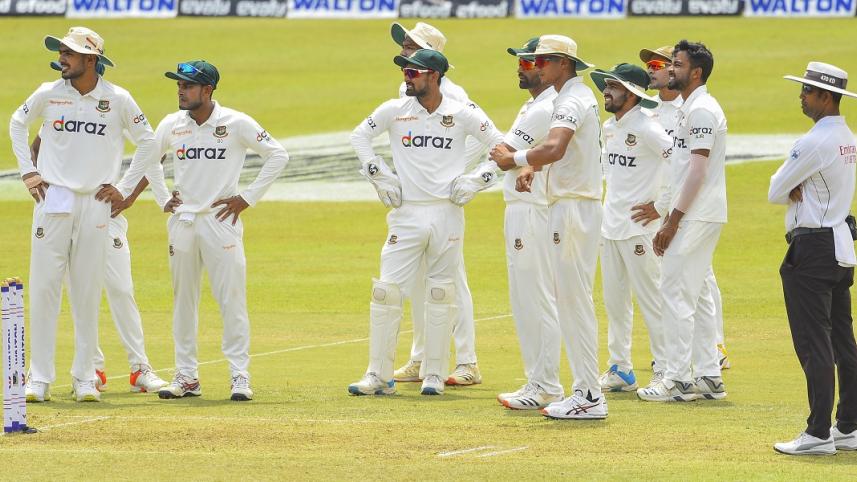 Bangladesh's cricketers look at the third umpire's dismissal of  Sri Lanka's Dimuth Karunaratne.jpg