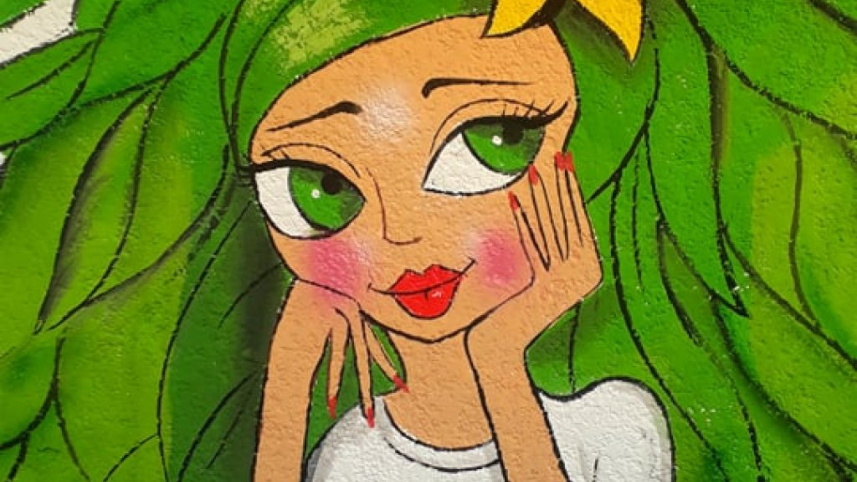 বাগদাদেদ দেওয়ালে আলি খলিফা  ও বাটারফ্লাই এফেক্টের আঁকা ম্যুরাল। ছবি: সংগৃহীত