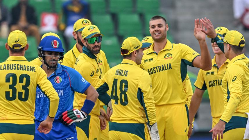 Australia's Spencer Johnson (3R) celebrates with teammates.jpg