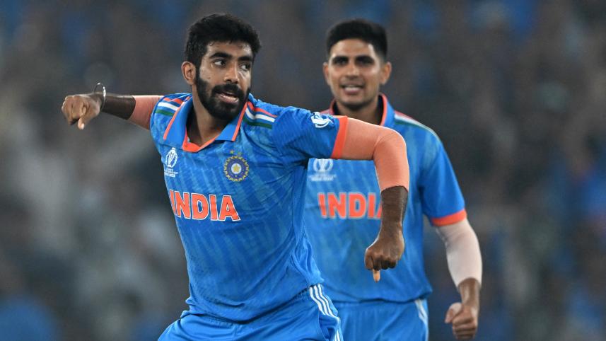 India's Jasprit Bumrah (L) celebrates with teammate Shubman Gill