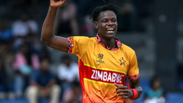 Zimbabwe's Blessing Muzarabani celebrates