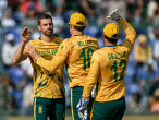 South Africa's Anrich Nortje (L) celebrates with teammates