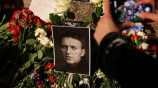 Flowers and portraits of Russian opposition leader Alexei Navalny