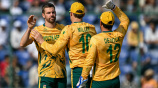 South Africa's Anrich Nortje (L) celebrates with teammates